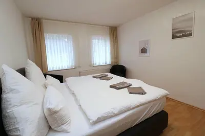 Ein Bett oder Betten in einem Zimmer der Unterkunft Aparthotel Kompass A 404