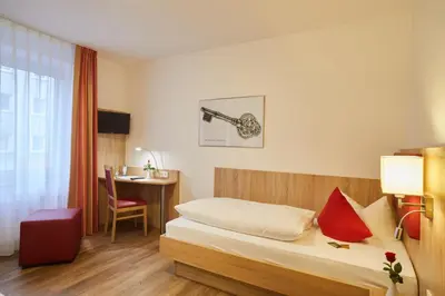 Ein Bett oder Betten in einem Zimmer der Unterkunft Hotel Zur Traube