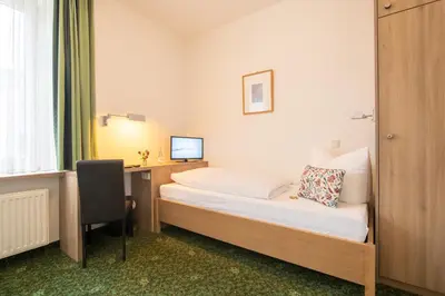Ein Bett oder Betten in einem Zimmer der Unterkunft Hotel Zur Traube