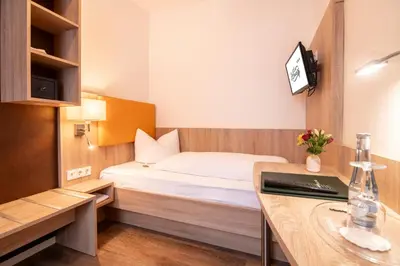 Ein Bett oder Betten in einem Zimmer der Unterkunft Hotel Zur Traube