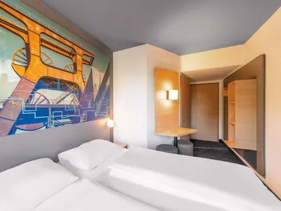 Ein Bett oder Betten in einem Zimmer der Unterkunft B&B HOTEL Essen-Nord