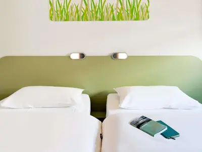 Ein Bett oder Betten in einem Zimmer der Unterkunft ibis budget Duisburg City am Innenhafen
