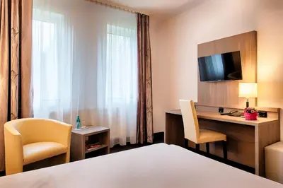 Ein Bett oder Betten in einem Zimmer der Unterkunft ACHAT Hotel Bochum Dortmund
