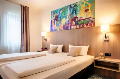 Ein Bett oder Betten in einem Zimmer der Unterkunft ACHAT Hotel Bochum Dortmund
