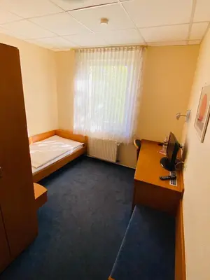 Ein Bett oder Betten in einem Zimmer der Unterkunft Hotel Montan