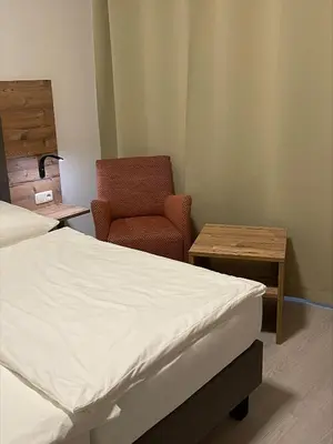Ein Bett oder Betten in einem Zimmer der Unterkunft Hotel Mintarder Wasserbahnhof