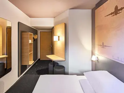 Ein Bett oder Betten in einem Zimmer der Unterkunft B&B HOTEL Dortmund-Airport