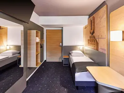 Ein Bett oder Betten in einem Zimmer der Unterkunft B&B HOTEL Dortmund-Airport