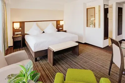 Ein Bett oder Betten in einem Zimmer der Unterkunft Ringhotel Zweibruecker Hof
