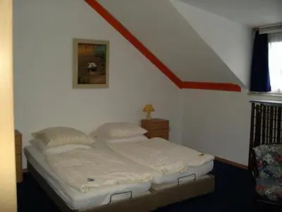 Ein Bett oder Betten in einem Zimmer der Unterkunft GT Hotel