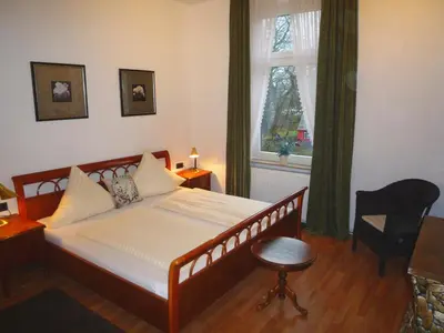 Ein Bett oder Betten in einem Zimmer der Unterkunft Hotel Alt-Lennep