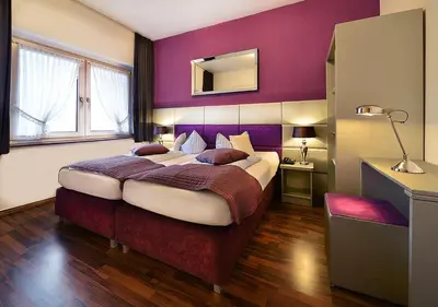 Ein Bett oder Betten in einem Zimmer der Unterkunft Hotel Am Wehrhahn