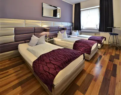 Ein Bett oder Betten in einem Zimmer der Unterkunft Hotel Am Wehrhahn