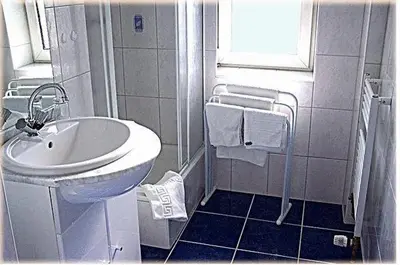 Ein Badezimmer in der Unterkunft Hotel Am Wehrhahn