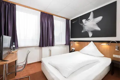 Ein Bett oder Betten in einem Zimmer der Unterkunft Days Inn Dortmund West