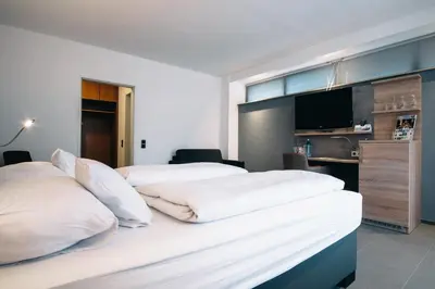Ein Bett oder Betten in einem Zimmer der Unterkunft Akzent Hotel Körner Hof