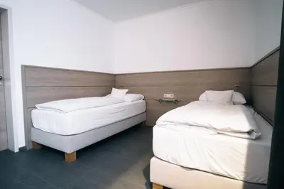 Ein Bett oder Betten in einem Zimmer der Unterkunft Akzent Hotel Körner Hof