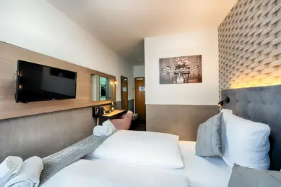 TV/Unterhaltungsangebot in der Unterkunft Home Hotel