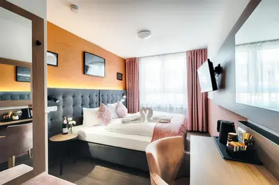 Ein Bett oder Betten in einem Zimmer der Unterkunft Home Hotel