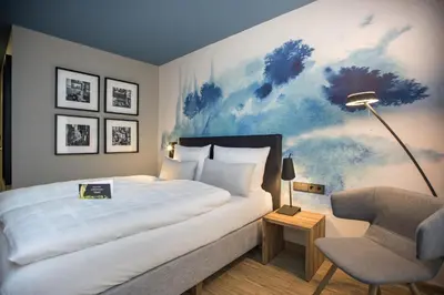 Ein Bett oder Betten in einem Zimmer der Unterkunft Arcadeon