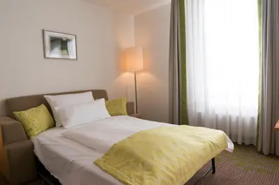 Ein Bett oder Betten in einem Zimmer der Unterkunft Hotel Mingarden