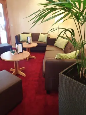 Ein Sitzbereich in der Unterkunft Hotel Mingarden
