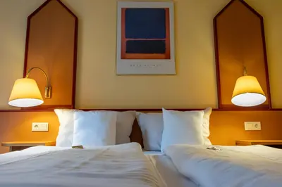 Ein Bett oder Betten in einem Zimmer der Unterkunft Montana Hotel Senden
