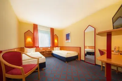 Ein Bett oder Betten in einem Zimmer der Unterkunft Montana Hotel Senden