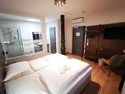Ein Bett oder Betten in einem Zimmer der Unterkunft Hotel Zu Freunden