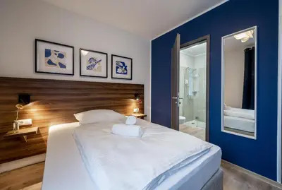 Ein Bett oder Betten in einem Zimmer der Unterkunft Hotel Zu Freunden