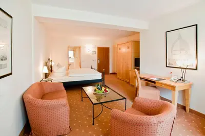 Ein Bett oder Betten in einem Zimmer der Unterkunft Hotel Barbarossa