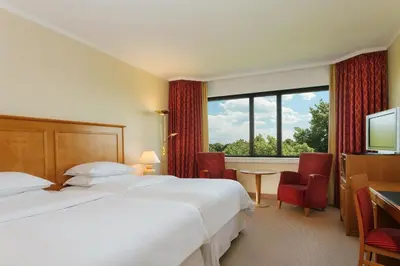 Ein Bett oder Betten in einem Zimmer der Unterkunft Sheraton Essen Hotel