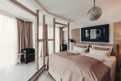 Ein Bett oder Betten in einem Zimmer der Unterkunft Boutique Hotel Düsseldorf Berial