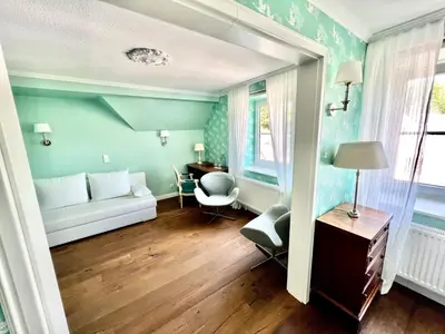 Ein Bett oder Betten in einem Zimmer der Unterkunft Hotel Ashley's Garden