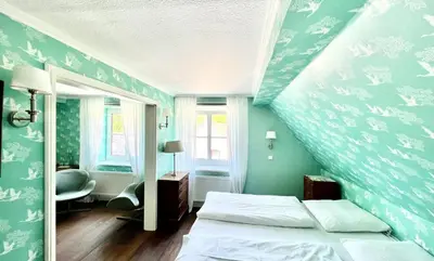 Ein Bett oder Betten in einem Zimmer der Unterkunft Hotel Ashley's Garden