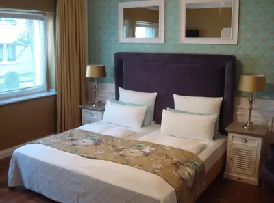 Ein Bett oder Betten in einem Zimmer der Unterkunft Boutique Hotel Sir & Lady Astor - The Charming City Hotels