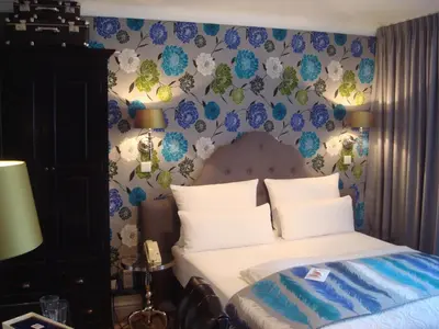 Ein Bett oder Betten in einem Zimmer der Unterkunft Boutique Hotel Sir & Lady Astor - The Charming City Hotels