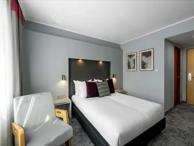 Ein Bett oder Betten in einem Zimmer der Unterkunft Ramada by Wyndham Essen