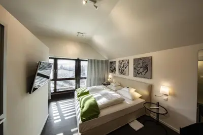 Ein Bett oder Betten in einem Zimmer der Unterkunft Mintrops Land Hotel Burgaltendorf