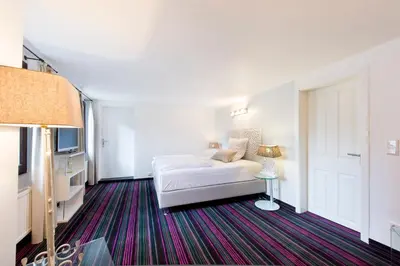 Ein Bett oder Betten in einem Zimmer der Unterkunft Pension Café Eisgold