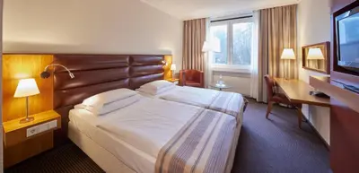 Ein Bett oder Betten in einem Zimmer der Unterkunft Hotel Bredeney