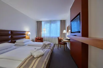 Ein Bett oder Betten in einem Zimmer der Unterkunft Hotel Bredeney