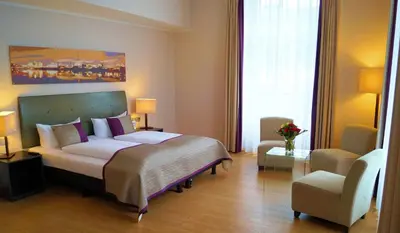 Ein Bett oder Betten in einem Zimmer der Unterkunft Wyndham Duisburger Hof
