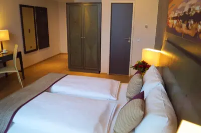 Ein Bett oder Betten in einem Zimmer der Unterkunft Wyndham Duisburger Hof