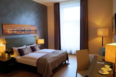 Ein Bett oder Betten in einem Zimmer der Unterkunft Wyndham Duisburger Hof