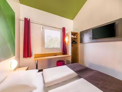 Ein Bett oder Betten in einem Zimmer der Unterkunft B&B Hotel Bochum-Herne