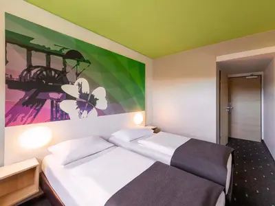 Ein Bett oder Betten in einem Zimmer der Unterkunft B&B Hotel Bochum-Herne