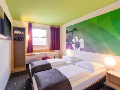 Ein Bett oder Betten in einem Zimmer der Unterkunft B&B Hotel Bochum-Herne