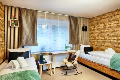 Ein Bett oder Betten in einem Zimmer der Unterkunft Hotel Fürst Garden