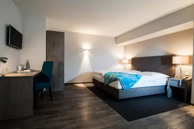 Ein Bett oder Betten in einem Zimmer der Unterkunft Hotel Alte Redaktion